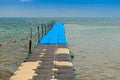 Pontoon bridge made of plastic cube on the sea Royalty Free Stock Photo