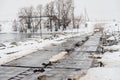 Pontoon bridge over the river, winter landscape Royalty Free Stock Photo