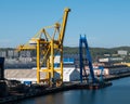 Pontoon crane and container crane at the port of Gdynia, Poland.