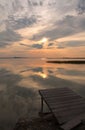 Pontoon on the lake at the sunset time