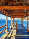 Pontoon over lake and roof and wooden beams in Patagonian landscape. Structures and wooden decks. Close up of Wooden Pier Royalty Free Stock Photo