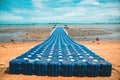 pontoon plastic bridge on Bang Saray beach, bay at low tide.