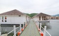 Pontoon walkway into raft house floating on the river Royalty Free Stock Photo