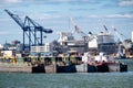 Pontoons and cranes unloading a cargo ship at the New York Harbor