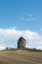 Tourists visit the famous and historic Moidrey Windmill near Le Mont Saint-Michel in France