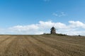 Tourists visit the famous and historic Moidrey Windmill near Le Mont Saint-Michel in France