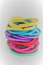 Girls colorful pony tail holders in a stack Isolated