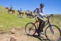 Pony trekking in Lesotho near Semonkong. Young local cyclist.