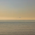 The silhouette of the island of Ponza emerging from the fog Royalty Free Stock Photo