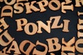 Ponzi, text words typography written with wooden letter on black background, life and business motivational inspirational