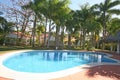 Pool Area with palms & Dining Gazebo Royalty Free Stock Photo