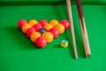 Pool balls, chalk and cue on a table Royalty Free Stock Photo