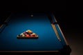 Pool balls and cues on a blue baize table Royalty Free Stock Photo