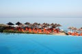 Pool and beach umbrellas in Greece. Royalty Free Stock Photo
