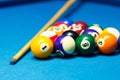 Pool billiard balls and cue on the table Royalty Free Stock Photo