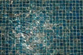 A pool with blue ceramic tiles and water ripple effect. Refection of Blue water in Swimming pool with Ripple. close-up Royalty Free Stock Photo