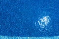 Pool, blue clear water in the outdoor Swimming pool, with sun flare on the surface. Background of blue water Royalty Free Stock Photo
