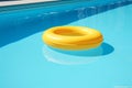 ring resort sunlight float water vacation pool rescue circle yellow. Generative AI.