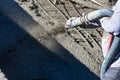 Pool Construction Worker Shooting Concrete, Shotcrete or Gunite Through Hose Royalty Free Stock Photo