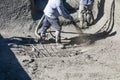 Pool Construction Worker Shooting Concrete, Shotcrete or Gunite Through Hose