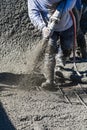 Pool Construction Worker Shooting Concrete, Shotcrete or Gunite Through Hose