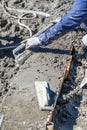 Pool Construction Worker Working With A Smoother Rod On Wet Concrete Royalty Free Stock Photo