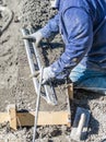 Pool Construction Worker Working With A Smoother Rod On Wet Concrete Royalty Free Stock Photo