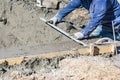 Pool Construction Worker Working With A Smoother Rod On Wet Concrete Royalty Free Stock Photo