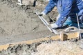 Pool Construction Worker Working With A Smoother Rod On Wet Concrete Royalty Free Stock Photo