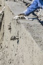 Pool Construction Worker Working With Wood Float On Wet Concrete Royalty Free Stock Photo