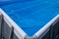Pool cover. Blue solar film on the pool. Royalty Free Stock Photo