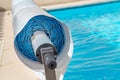 Pool cover on the edge of a pool during the summer Royalty Free Stock Photo