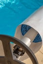 Pool cover on the edge of a pool during the summer Royalty Free Stock Photo