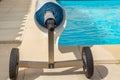 Pool cover on the edge of a pool during the summer Royalty Free Stock Photo