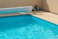 Pool cover on the edge of a pool during the summer Royalty Free Stock Photo