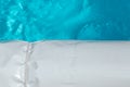 Pool cover on the edge of a pool during the summer Royalty Free Stock Photo