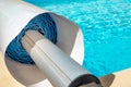 Pool cover on the edge of a pool during the summer Royalty Free Stock Photo