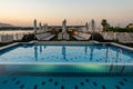 Pool deck and parasols of luxury boat cruise ship in egypt luxor during dawn sunset Royalty Free Stock Photo