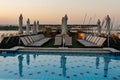 Pool deck and parasols of luxury boat cruise ship in egypt luxor during dawn sunset Royalty Free Stock Photo