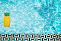 Pool float, ring floating in a refreshing blue swimming pool with palm tree leaf shadows in water Royalty Free Stock Photo