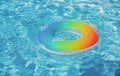 Pool float, ring floating in a refreshing blue swimming pool. Summer background. Royalty Free Stock Photo