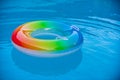 Pool float, ring floating in a refreshing blue swimming pool. Summer background. Royalty Free Stock Photo