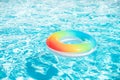 Pool float, ring floating in a refreshing blue swimming pool on summer background. Royalty Free Stock Photo