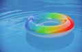 Pool float, ring floating in a refreshing blue swimming pool. Summer background. Royalty Free Stock Photo