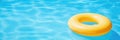 Pool Float In A Swimming Pool A Yellow Pool Float Ring Floating In A Refreshing Blue Swimming Pool