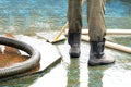 Pool or fountain cleaner boots, brush removes debris from the surface, corrugated hose