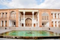 Pool with fountain inside the courtyard of Qajar dinasty historical building Asef mansion