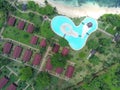 A pool in heart shape and bungalows at Ilheu das Rolas island ,Sao Tome e Principe