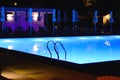 Pool illuminated at night. Blue water in the pool