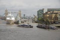 Pool of London ships berthed near Tower Bridge UK